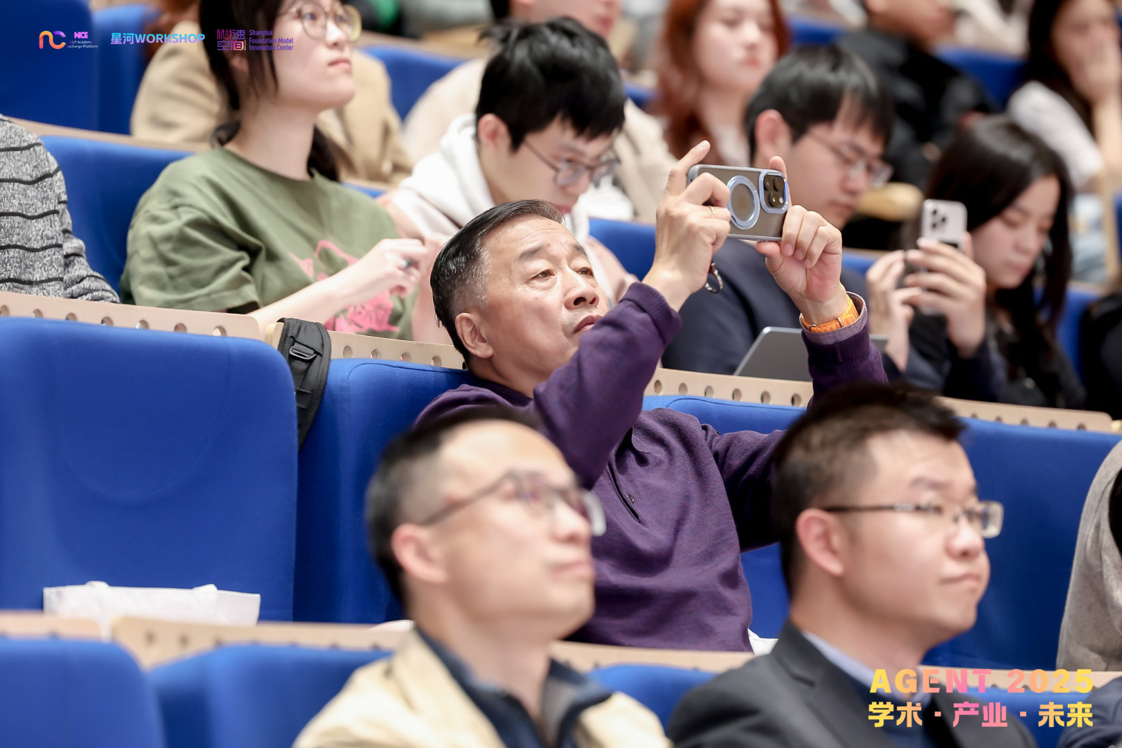 Audience member taking photos